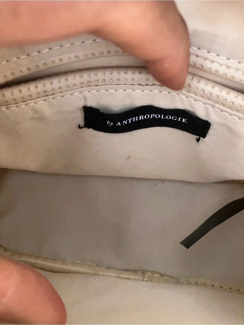 Anthropologie Cream Perforated Crossbody Camera Bag with Tassel